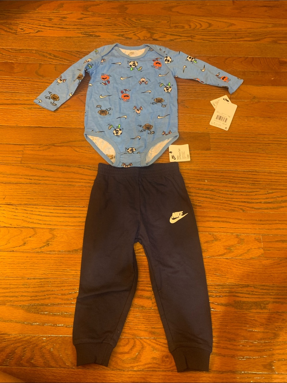 Nike Light Blue Sports Print Long-Sleeve Bodysuit with Navy Nike Joggers